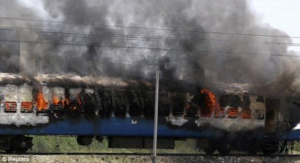 A passenger train burns in Jalandhar, in the northern Indian state of Punjab as thousands of protesters take to the streets after an attack in a Sikh temple in Austria. (Source Daily Mail)